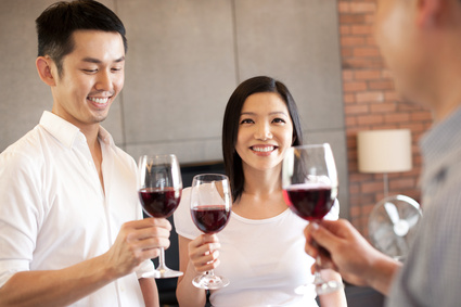 Asian family having wine 