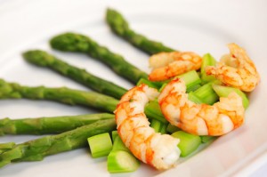 Shrimps and asparagus, plate with fresh shrimps